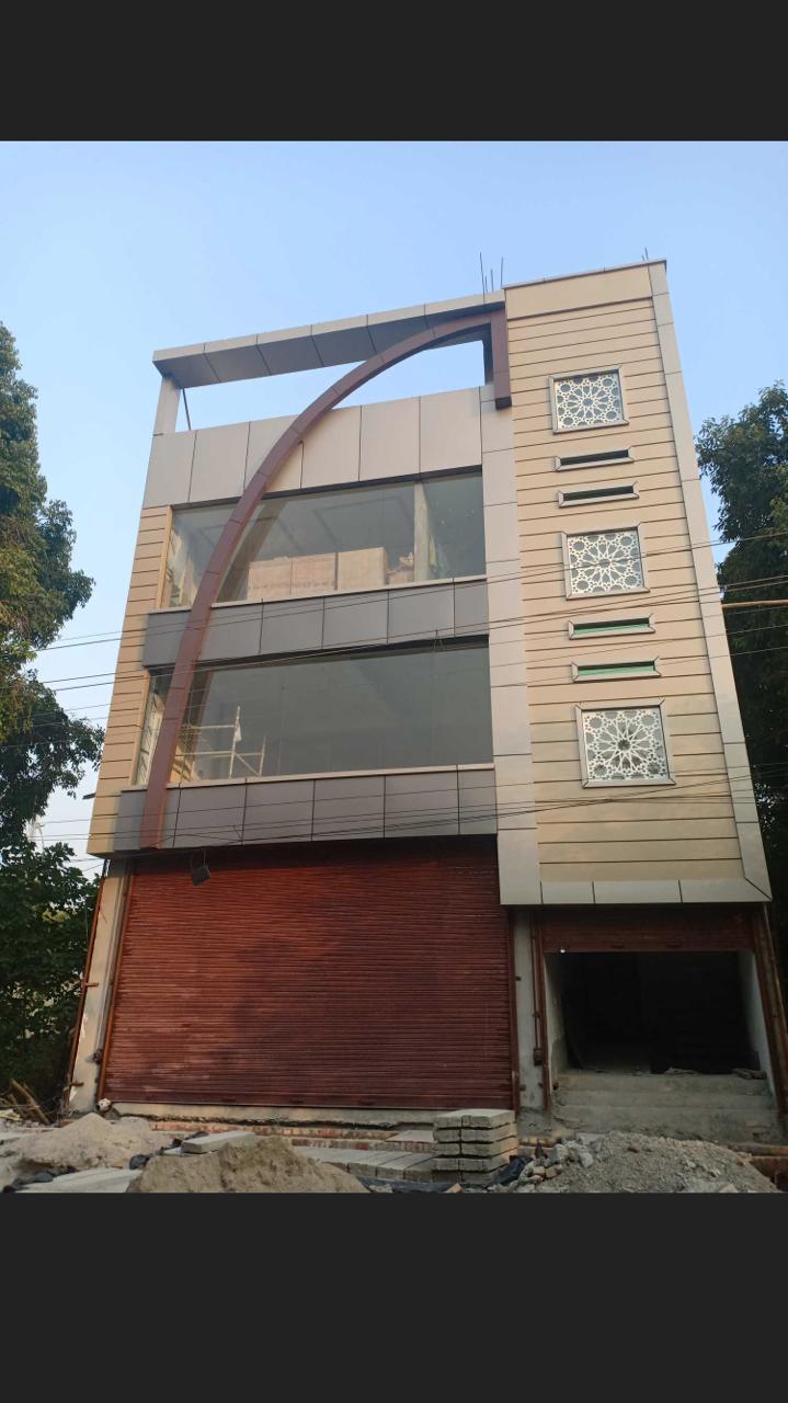 Commercial elevation with large glass panels and curved facade accent