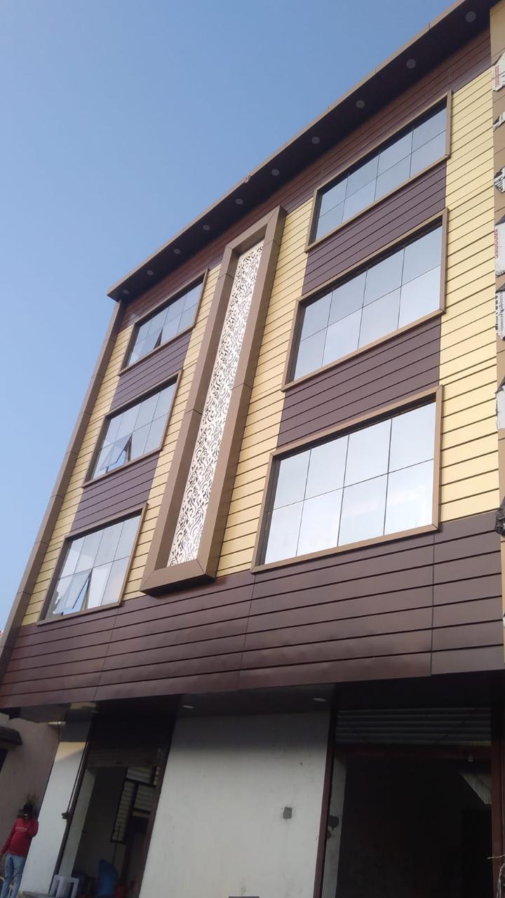 Commercial facade with glass windows and decorative vertical screen