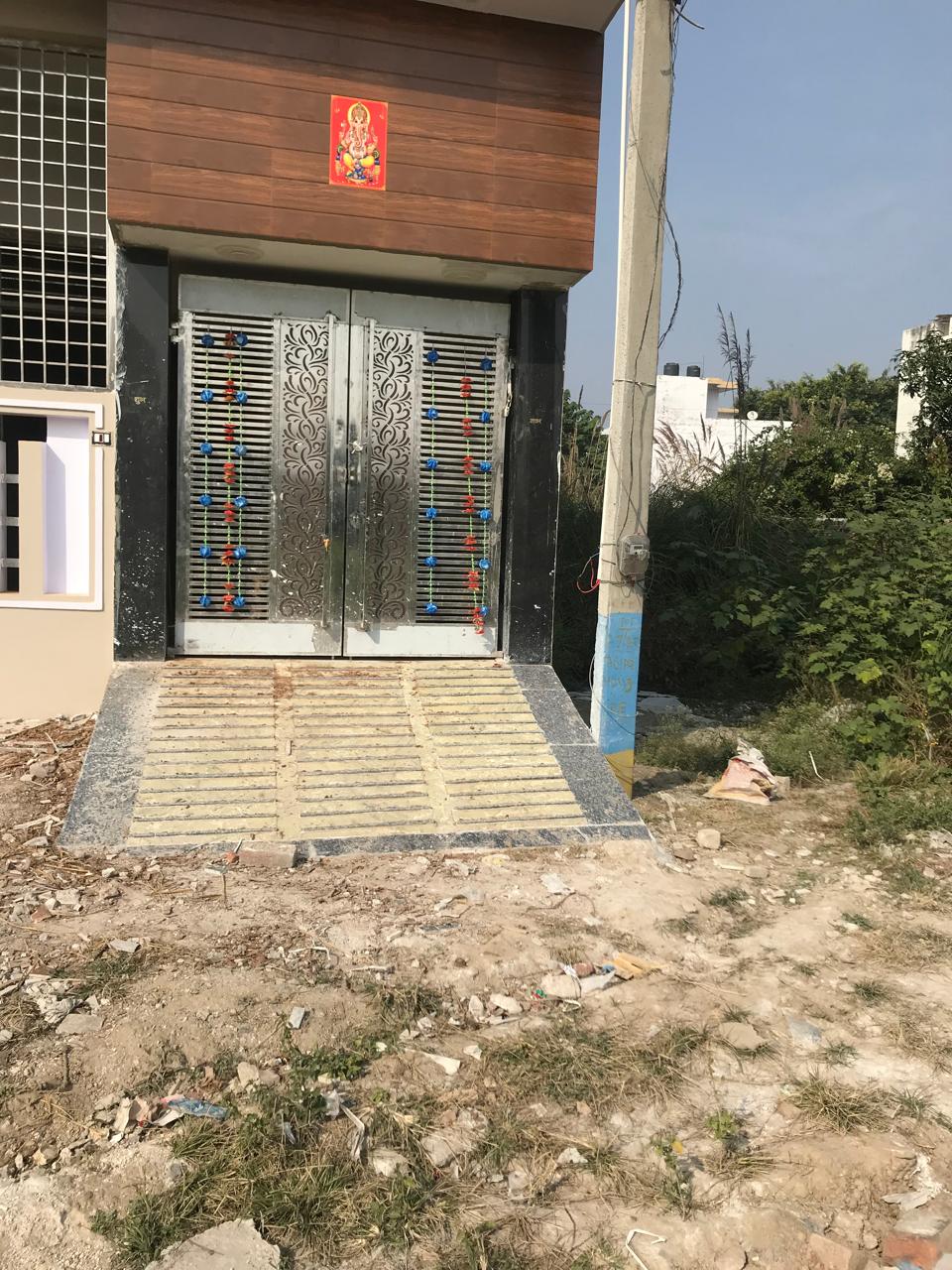 Metal entrance gate with decorative cutout panels