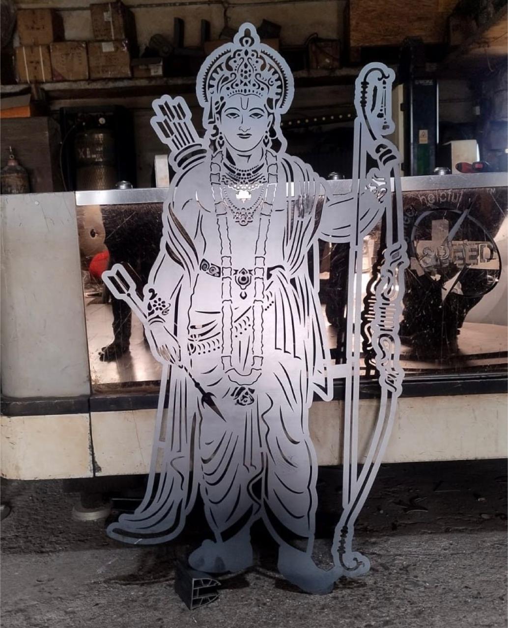 Decorative laser-cut metal figure at the workshop