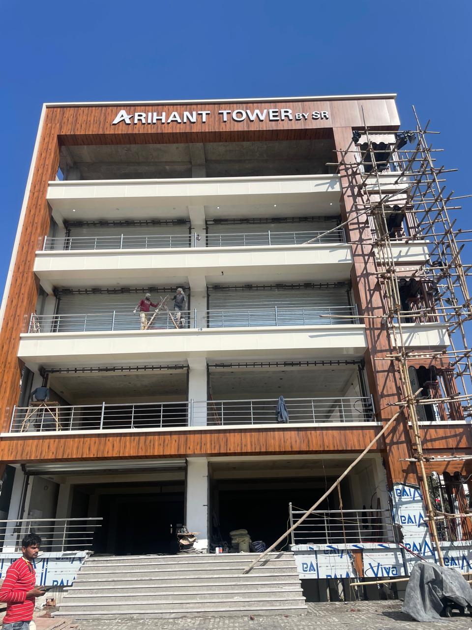 Commercial building with cladding, railings and shutters