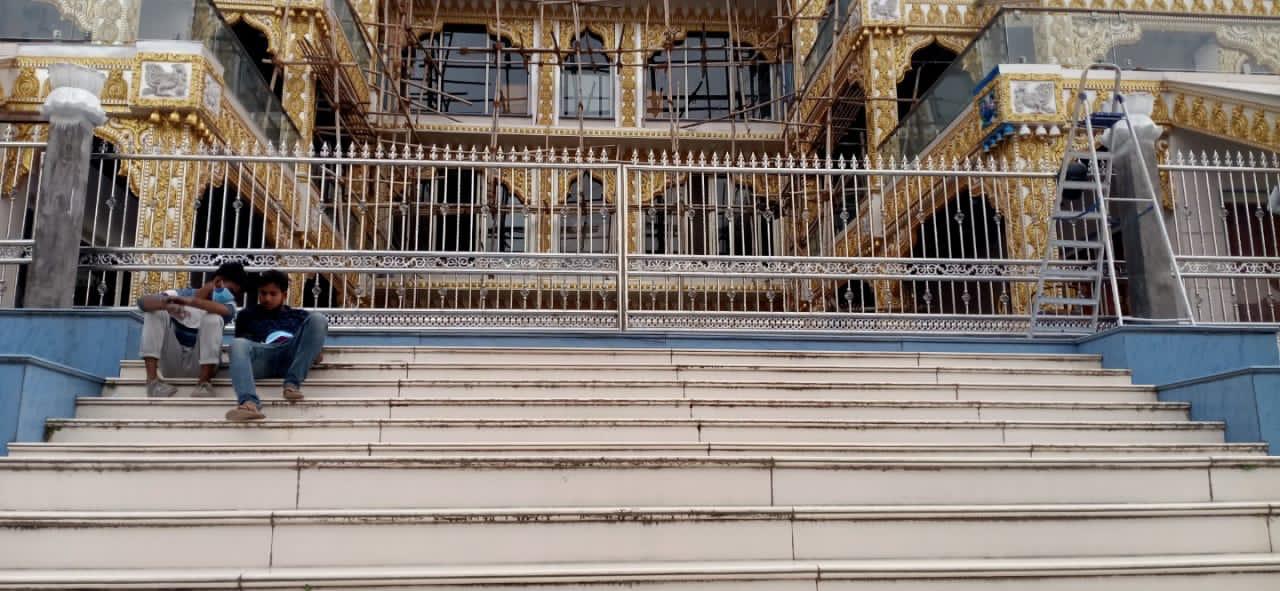 Decorative metal railing across the front of a building