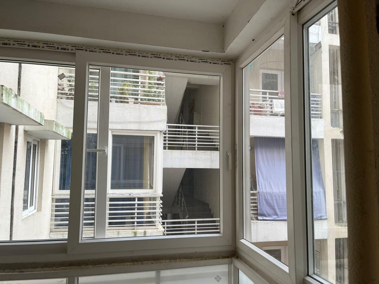 White framed windows installed along a wall